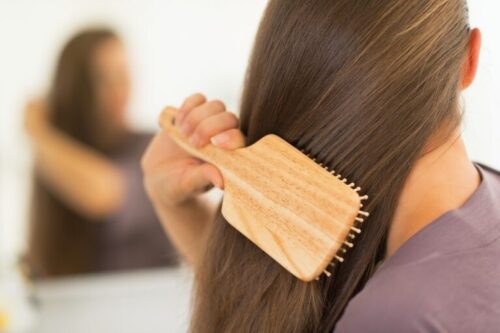 girl combing her hair